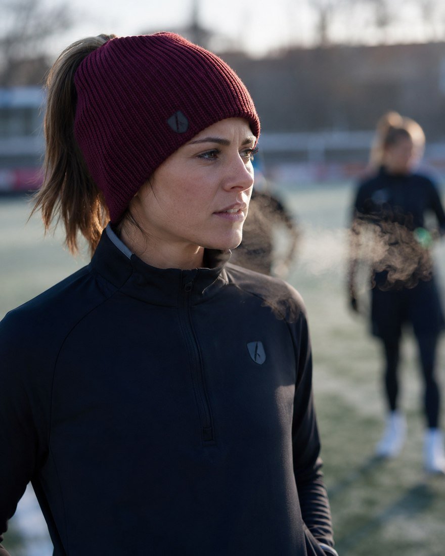 Athlete in a maroon beanie on a frosty morning